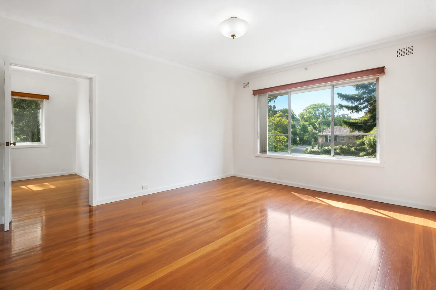 A clean, empty room presented ready for sale
